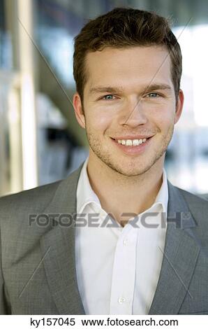 Portrait of a businessman smiling View Large Photo Image Stock Photography - Portrait of a businessman smiling. Fotosearch