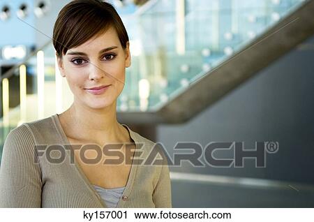 Portrait of a young woman smiling View Large Photo Image Stock Image - Portrait of a young woman smiling. Fotosearch