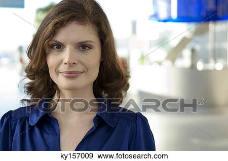 Portrait of a young woman smiling View Large Photo Image Stock Photo - Portrait of a young woman smiling. Fotosearch
