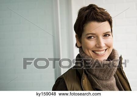 Close-up of a mid adult woman smiling View Large Photo Image Stock Photo - Close-up of a mid adult woman smiling. Fotosearch