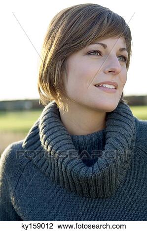 Stock Image - Close-up of a young woman smiling. Fotosearch