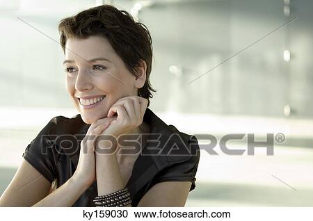 Mid adult woman smiling View Large Photo Image Stock Image - Mid adult woman smiling. Fotosearch