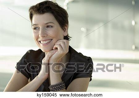 Mid adult woman smiling View Large Photo Image Stock Photography - Mid adult woman smiling. Fotosearch