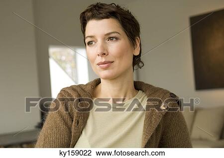 Mid adult woman thinking View Large Photo Image Stock Image - Mid adult woman thinking. Fotosearch
