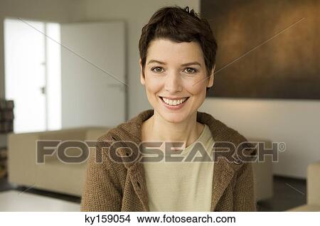 Portrait of a mid adult woman smiling View Large Photo Image Picture - Portrait of a mid adult woman smiling. Fotosearch