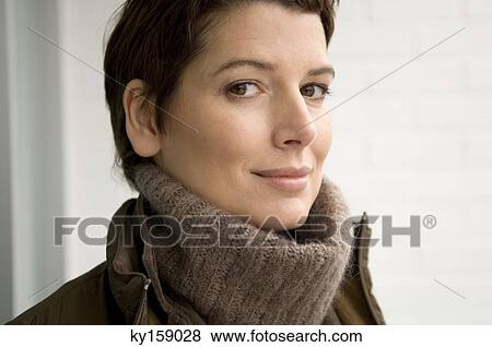 Portrait of a mid adult woman smiling View Large Photo Image Stock Photo - Portrait of a mid adult woman smiling. Fotosearch