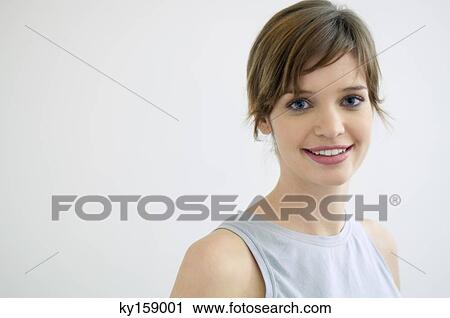 Portrait of a young woman smiling View Large Photo Image Stock Image - Portrait of a young woman smiling. Fotosearch