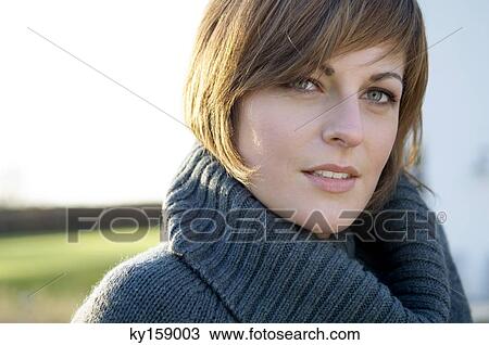 Portrait of a young woman smiling View Large Photo Image Stock Image - Portrait of a young woman smiling. Fotosearch