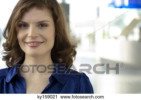Portrait of a young woman smiling View Large Photo Image Stock Image - Portrait of a young woman smiling. Fotosearch