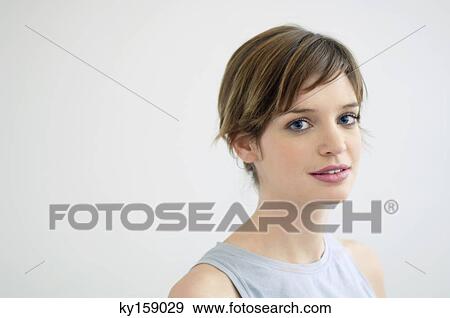 Portrait of a young woman smiling View Large Photo Image Stock Photo - Portrait of a young woman smiling. Fotosearch