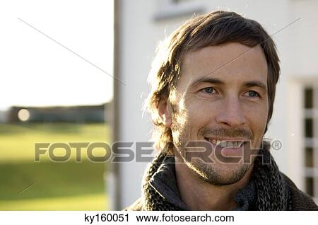 Close-up of a mid adult man smiling View Large Photo Image Stock Image - Close-up of a mid adult man smiling. Fotosearch