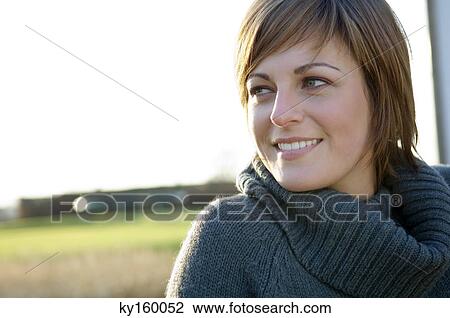 Stock Image - Close-up of a young woman smiling. Fotosearch