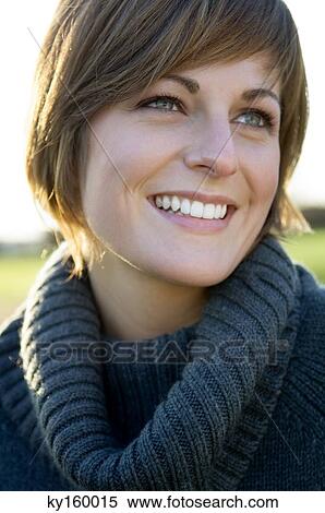 Close-up of a young woman smiling View Large Photo Image Stock Photography - Close-up of a young woman smiling. Fotosearch
