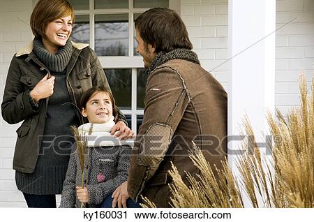 Stock Image - Girl talking with her parents. Fotosearch