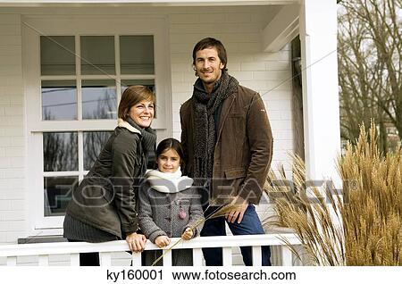 Girl with her parents smiling in a balcony View Large Photo Image Stock Image - Girl with her parents smiling in a balcony. Fotosearch