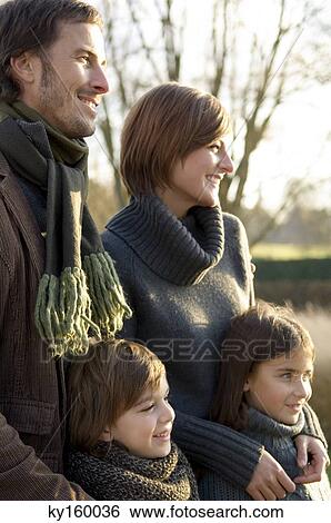 Two children smiling with their parents View Large Photo Image Stock Photograph - Two children smiling with their parents. Fotosearch