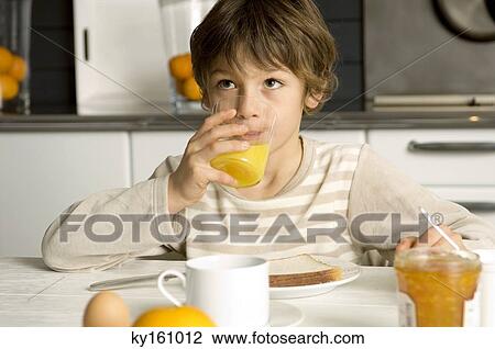 Boy having breakfast View Large Photo Image Stock Image - Boy having breakfast. Fotosearch