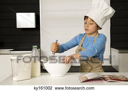 Boy making a cake View Large Photo Image Stock Image - Boy making a cake. Fotosearch