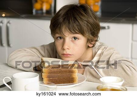 Portrait of a boy having breakfast View Large Photo Image Picture - Portrait of a boy having breakfast. Fotosearch