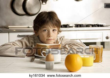 Portrait of a boy having breakfast View Large Photo Image Picture - Portrait of a boy having breakfast. Fotosearch