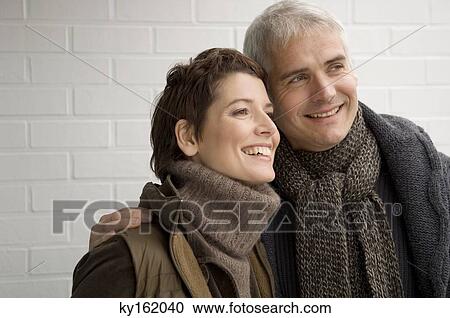 Close-up of a mature man and a mid adult woman smiling View Large Photo Image Stock Image - Close-up of a mature man and a mid adult woman smiling. Fotosearch