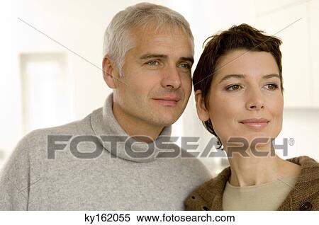 Close-up of a mature man and a mid adult woman looking away View Large Photo Image Stock Photography - Close-up of a mature man and a mid adult woman looking away. Fotosearch