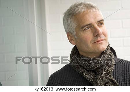 Close-up of a mature man thinking View Large Photo Image Stock Image - Close-up of a mature man thinking. Fotosearch