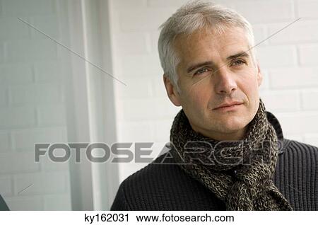 Close-up of a mature man thinking View Large Photo Image Stock Image - Close-up of a mature man thinking. Fotosearch