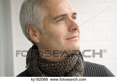 Close-up of a mature man thinking View Large Photo Image Stock Photo - Close-up of a mature man thinking. Fotosearch