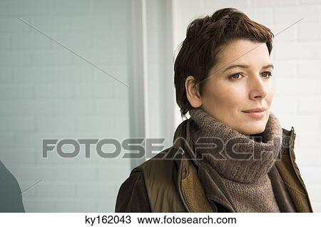 Stock Image - Close-up of a mid adult woman thinking. Fotosearch