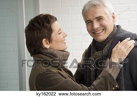 Mature man and a mid adult woman smiling View Large Photo Image Stock Image - Mature man and a mid adult woman smiling. Fotosearch