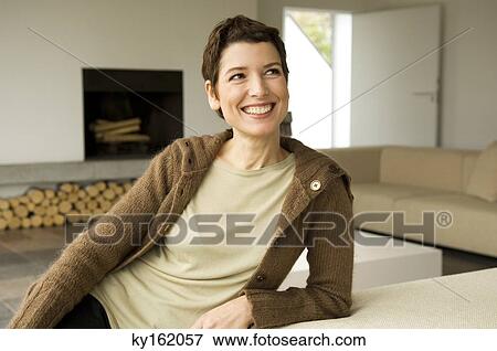 Stock Photo - Mid adult woman smiling. Fotosearch