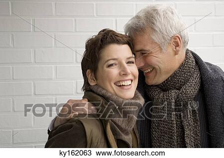Portrait of a mature man and a mid adult woman romancing View Large Photo Image Stock Image - Portrait of a mature man and a mid adult woman romancing. Fotosearch