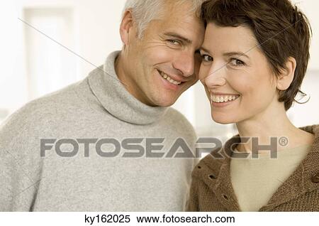 Portrait of a mature man and a mid adult woman romancing View Large Photo Image Stock Photography - Portrait of a mature man and a mid adult woman romancing. Fotosearch