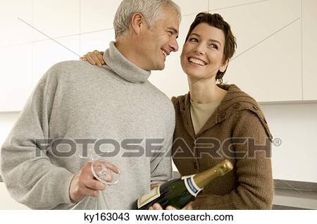 Mature man and a mid adult woman smiling View Large Photo Image Stock Image - Mature man and a mid adult woman smiling. Fotosearch