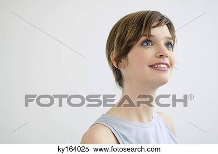 Stock Photography - Close-up of a young woman smiling. Fotosearch