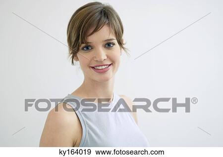Stock Photo - Portrait of a young woman smiling. Fotosearch