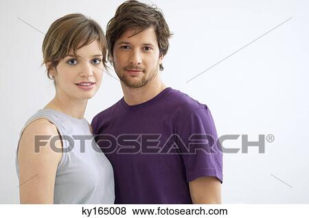 Portrait of a mid adult man and a young woman smiling View Large Photo Image Stock Photo - Portrait of a mid adult man and a young woman smiling. Fotosearch