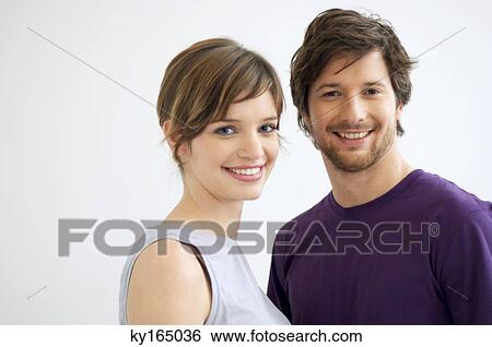 Portrait of a mid adult man and a young woman smiling View Large Photo Image Stock Photograph - Portrait of a mid adult man and a young woman smiling. Fotosearch