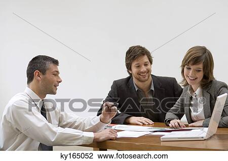 Real estate agent discussing a blueprint with a couple View Large Photo Image Stock Image - Real estate agent discussing a blueprint with a couple. Fotosearch