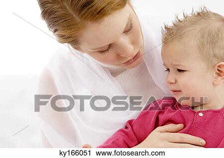 Close-up of a young woman talking with her crying son View Large Photo Image Stock Image - Close-up of a young woman talking with her crying son. Fotosearch