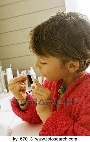 Boy cleaning his nail with a nail brush View Large Photo Image Stock Image - Boy cleaning his nail with a nail brush. Fotosearch