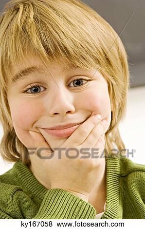 Close-up of a boy making a face View Large Photo Image Stock Photo - Close-up of a boy making a face. Fotosearch