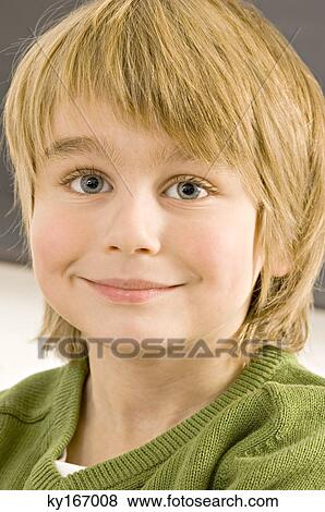Close-up of a boy smiling View Large Photo Image Stock Photo - Close-up of a boy smiling. Fotosearch