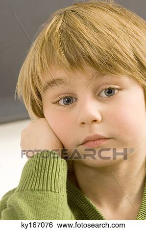 Close-up of a boy thinking View Large Photo Image Stock Photograph - Close-up of a boy thinking. Fotosearch