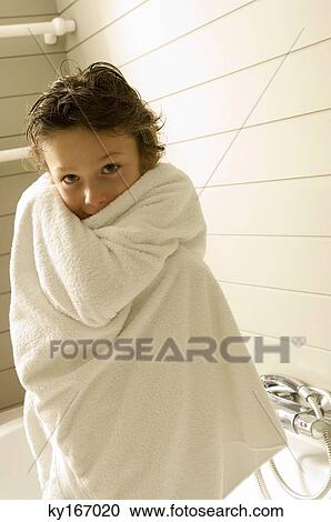Portrait of a boy wrapped in a towel View Large Photo Image Stock Image - Portrait of a boy wrapped in a towel. Fotosearch