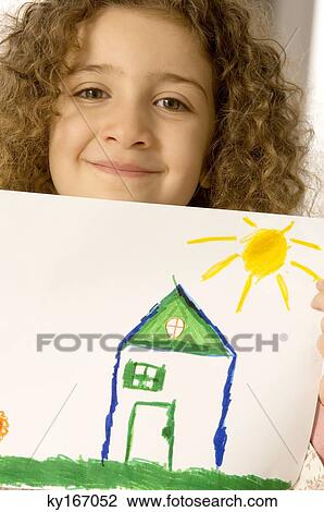 Portrait of a girl showing a drawing View Large Photo Image Stock Image - Portrait of a girl showing a drawing. Fotosearch