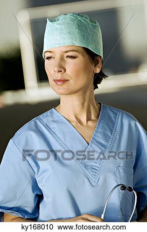Close-up of a female doctor holding a stethoscope View Large Photo Image Stock Image - Close-up of a female doctor holding a stethoscope. Fotosearch