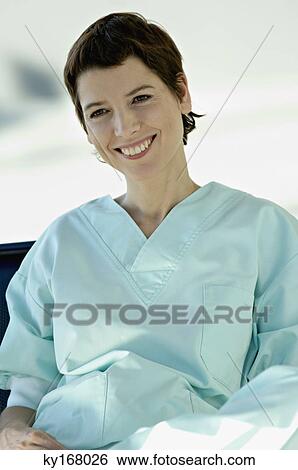 Stock Photograph - Close-up of a female doctor smiling. Fotosearch