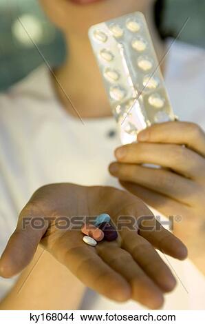 Close-up of pills on a doctor's palm View Large Photo Image Picture - Close-up of pills on a doctor's palm. Fotosearch